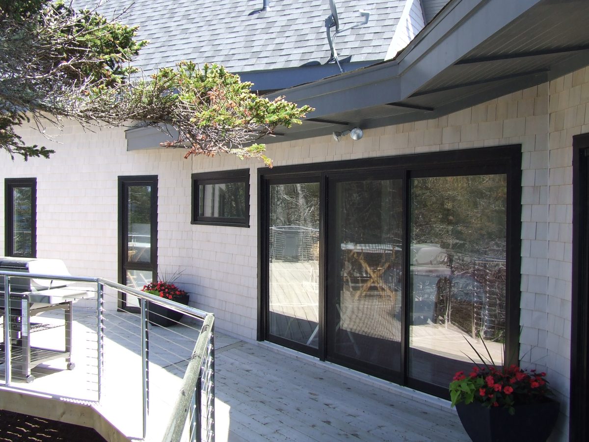 exterior view of black painted patio doors and windows