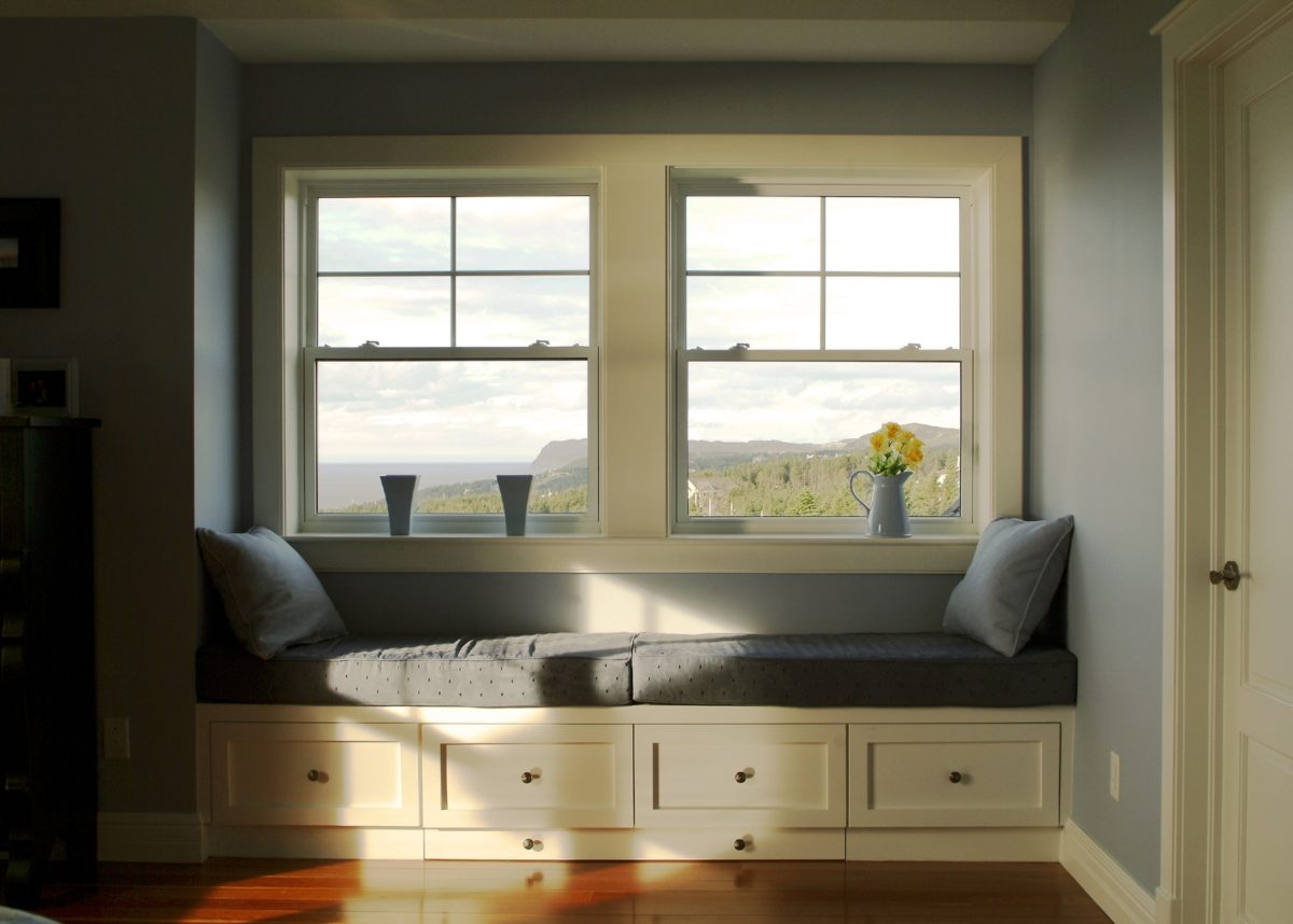 interior view of reading nook with bench seating and two single hung windows