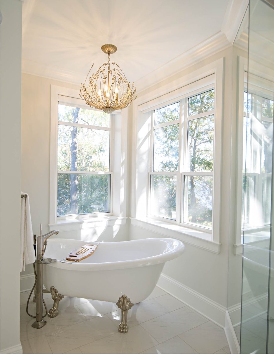 interior view of elegant bathroom with three sets of single hung windows