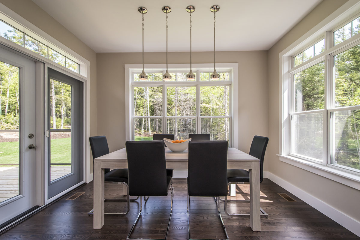 interior view of dinning room with five single hung windows and garden door